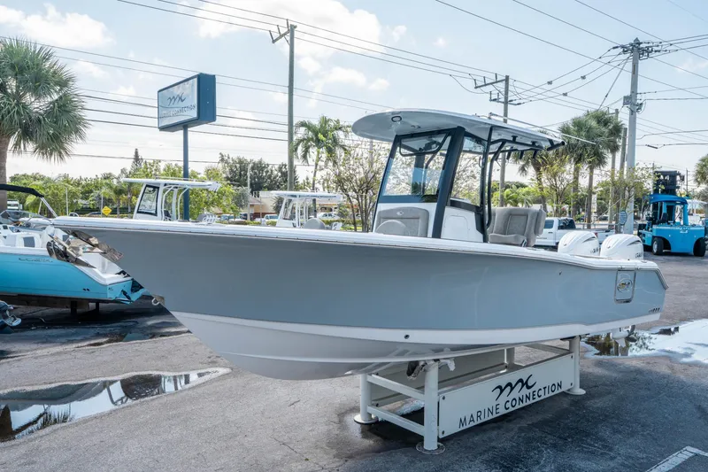 Slide: The Image of 2025 Sea Hunt Gamefish 25 boat displayed at Marine Connection dealership. - 6