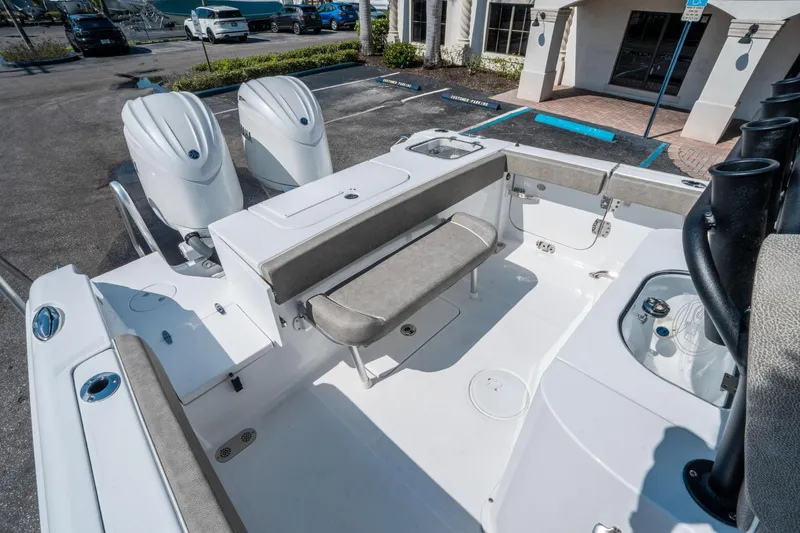 Slide: The Image of 2025 Sea Hunt Gamefish 25 boat interior with dual engines and seating. - 13