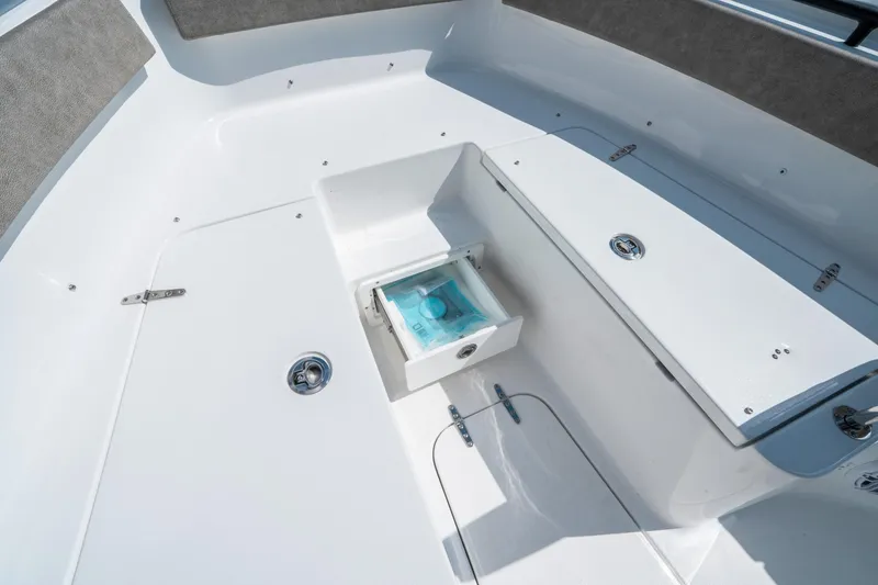 Slide: The Image of 2025 Sea Hunt Gamefish 25 boat interior with storage compartment and seating. - 31