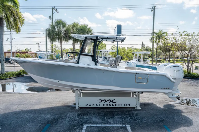 Slide: The Image of 2025 Sea Hunt Gamefish 25 boat displayed at Marine Connection dealership. - 5