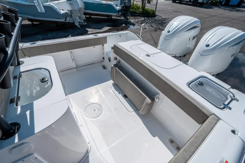Slide: The Image of 2025 Sea Hunt Gamefish 25 boat interior with dual engines and seating area. - 11