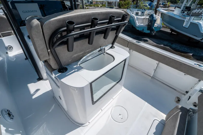 Slide: The Image of 2025 Sea Hunt Gamefish 25 boat interior with rod holders and sink. - 15