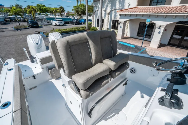 Slide: The Image of 2025 Sea Hunt Gamefish 25 boat interior with plush seating and modern controls. - 22