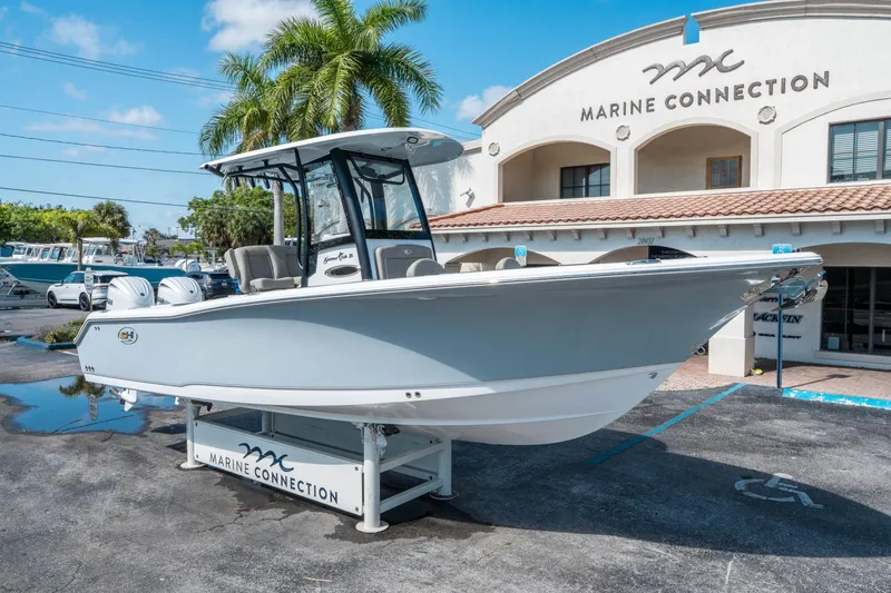 Slide: The Image of 2025 Sea Hunt Gamefish 25 boat displayed at Marine Connection dealership. - 8
