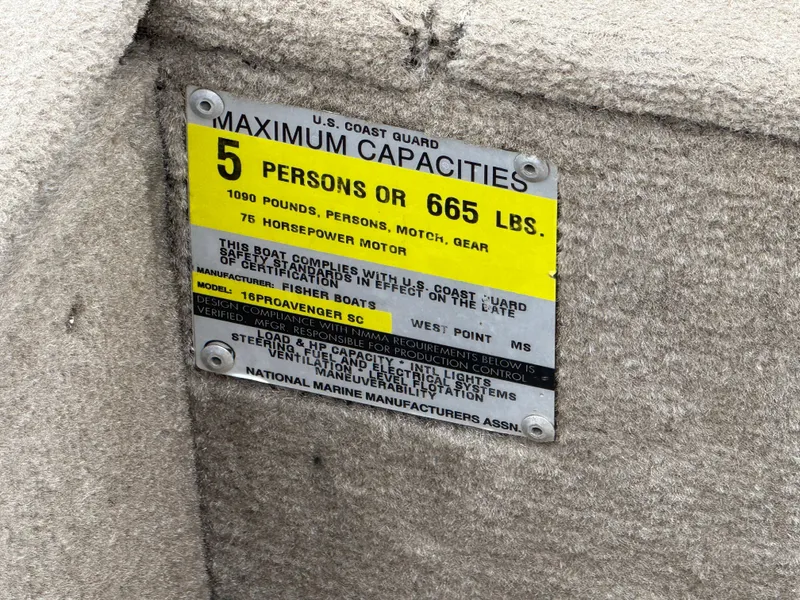 Slide: The Image of 1989 Fisher 16 Pro Avenger SC capacity plate, 5 persons or 665 lbs, 75 horsepower motor. - 16