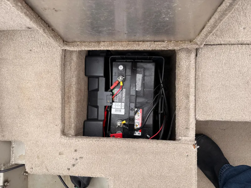 Slide: The Image of Battery compartment in 1989 Fisher 16 Pro Avenger SC boat, showing wiring and connections. - 19