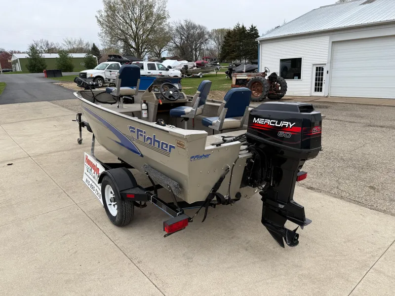 Slide: The Image of 1989 Fisher 16 Pro Avenger SC boat with Mercury outboard motor on trailer. - 5