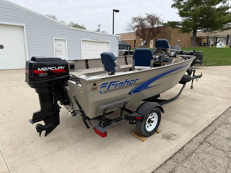 Slide: The Image of 1989 Fisher 16 Pro Avenger SC boat with Mercury outboard motor on trailer. - 7