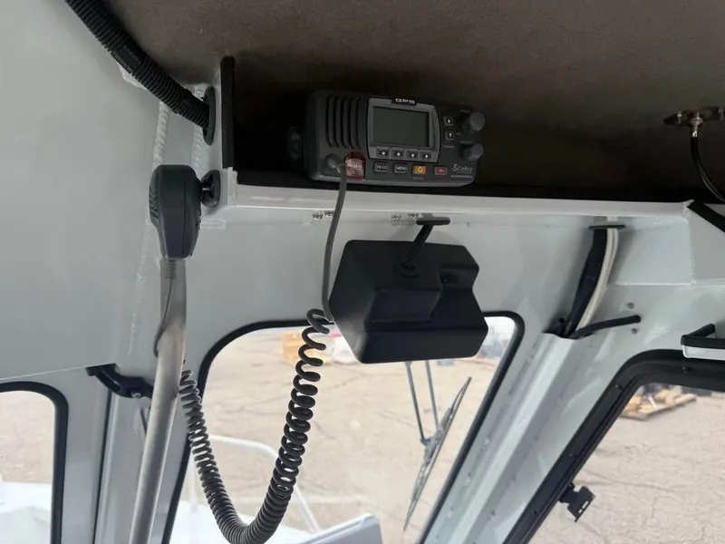 Slide: The Image of 2023 Hewescraft 240 Ocean Pro ET HT interior with radio equipment. - 15