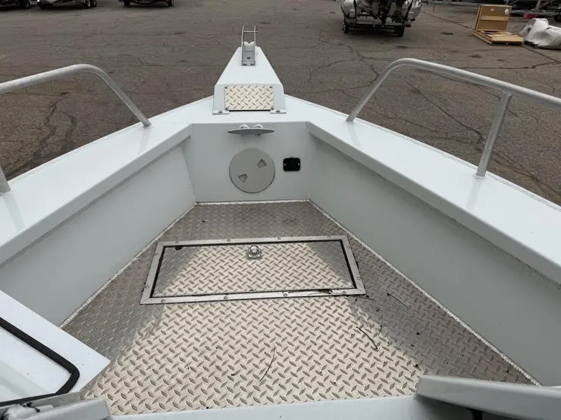 Slide: The Image of 2023 Hewescraft 240 Ocean Pro ET HT boat deck with diamond plate flooring. - 16