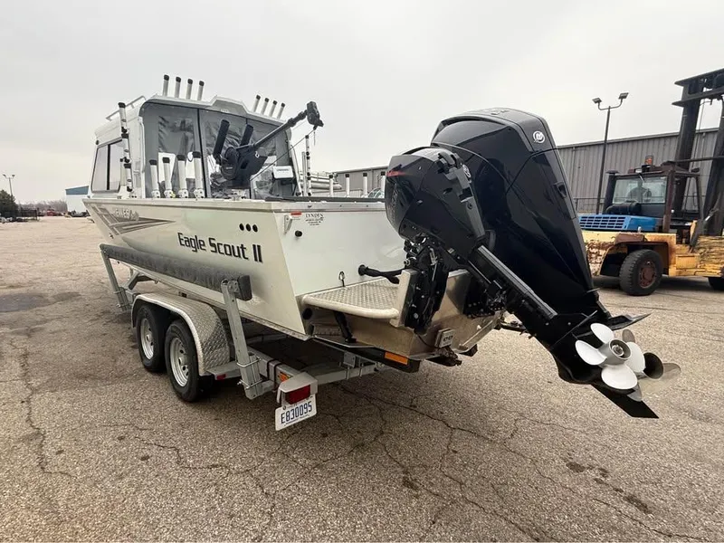 Slide: The Image of 2023 Hewescraft 240 Ocean Pro ET HT boat on trailer, rear view with outboard motor. - 4