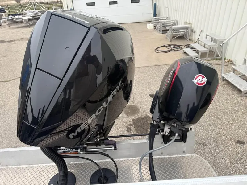 Slide: The Image of 2023 Hewescraft 240 Ocean Pro ET HT with dual Mercury outboard engines. - 6