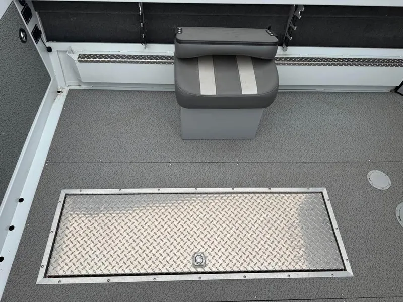 Slide: The Image of 2023 Hewescraft 240 Ocean Pro ET HT boat interior with seating and storage compartment. - 8