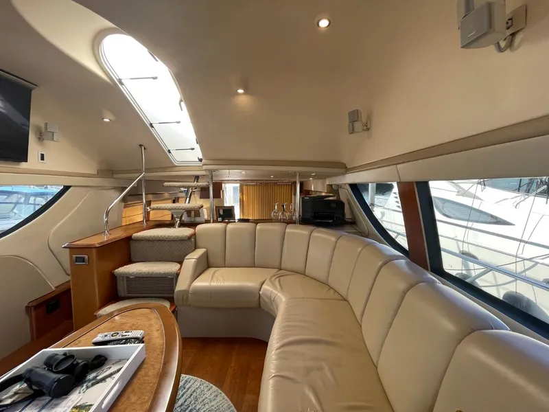 Slide: The Image of Luxurious interior of a 2006 Carver 56 Voyager yacht with plush seating and modern amenities. - 19