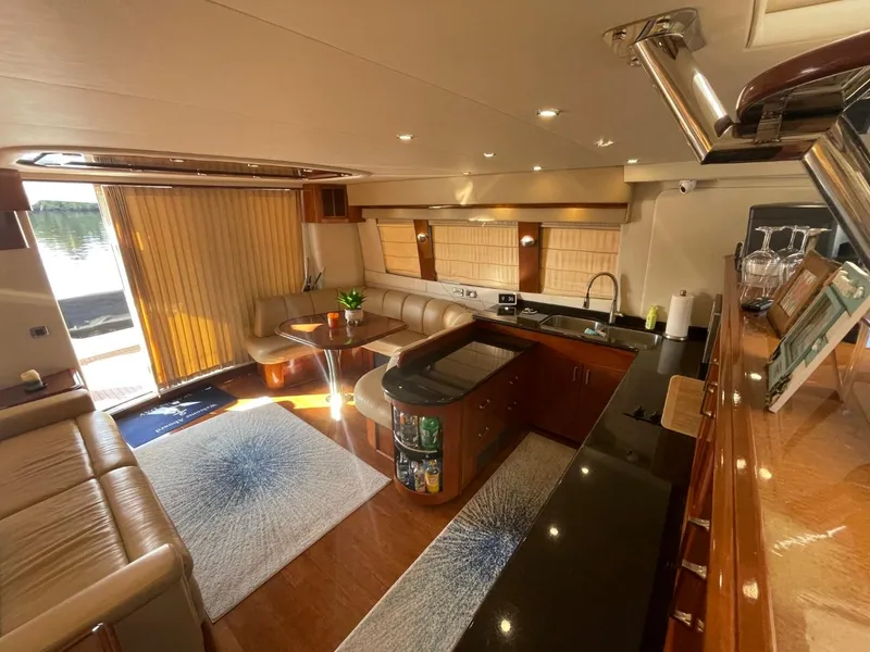 Slide: The Image of Luxurious interior of a 2006 Carver 56 Voyager yacht with elegant furnishings and modern amenities. - 22