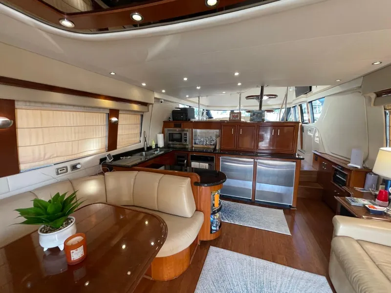 Slide: The Image of Luxurious interior of 2006 Carver 56 Voyager yacht with modern kitchen and dining area. - 26