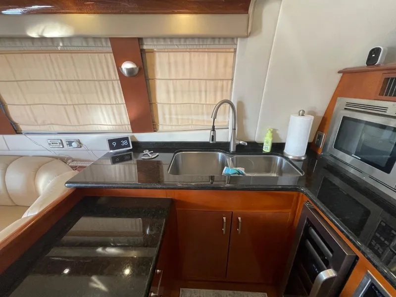 Slide: The Image of Luxurious kitchen interior of 2006 Carver 56 Voyager yacht with modern amenities. - 30