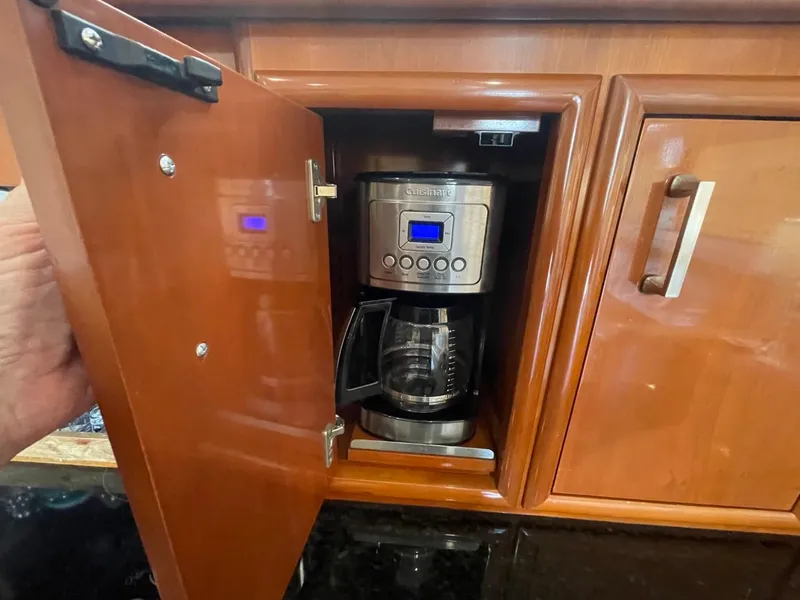 Slide: The Image of Coffee maker inside a wooden cabinet on a 2006 Carver 56 Voyager yacht. - 32