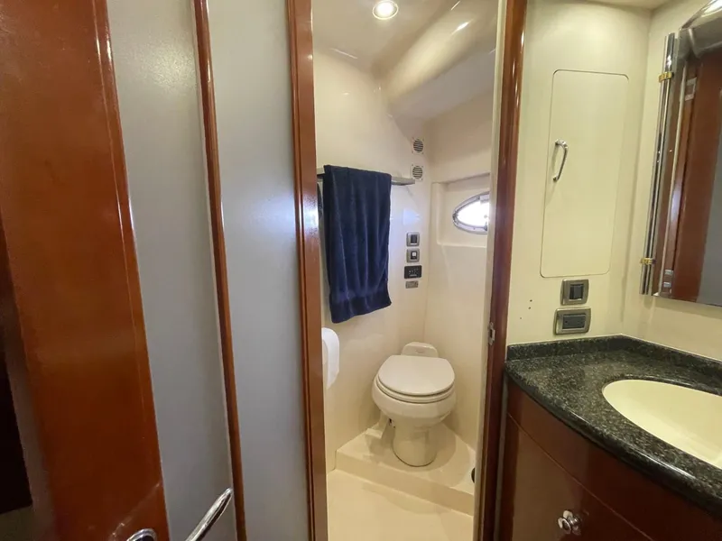 Slide: The Image of Bathroom interior of 2006 Carver 56 Voyager yacht, featuring toilet and sink. - 48