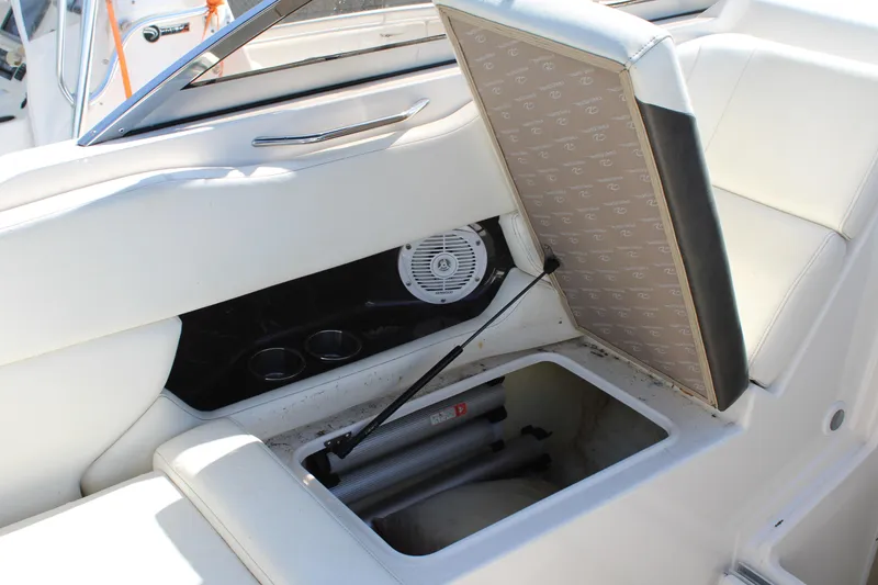Slide: The Image of Open storage compartment in 2006 Regal 2565 Window Express boat interior. - 15