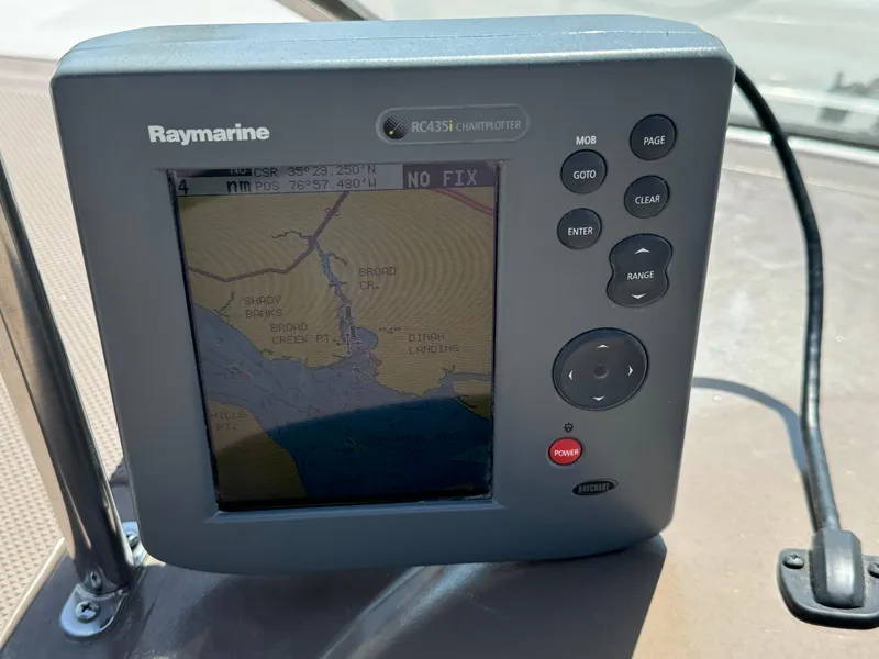 Slide: The Image of Raymarine RC435i chartplotter on 2006 Regal 2565 Window Express boat dashboard. - 21
