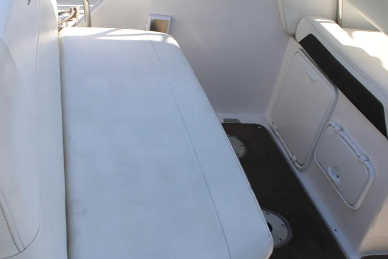 Slide: The Image of 2006 Regal 2565 Window Express boat interior seating and storage compartments. - 9