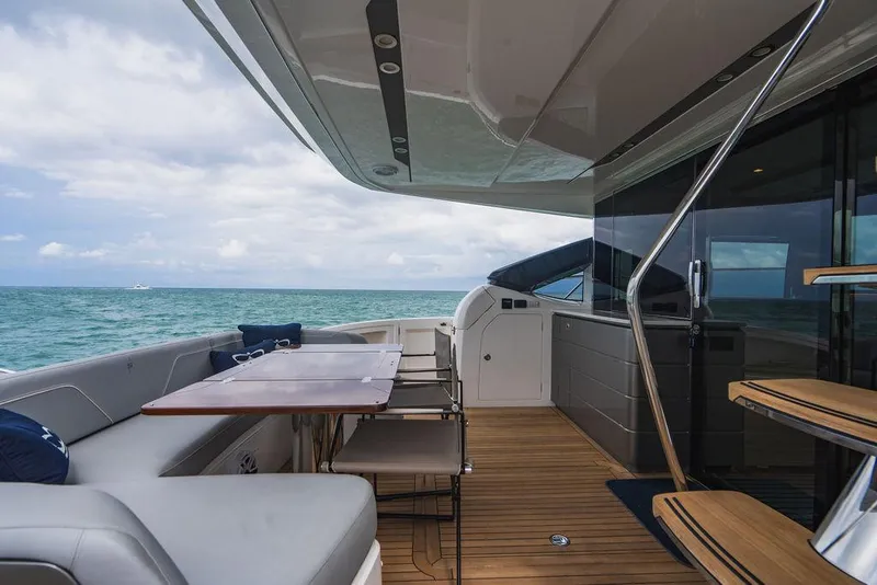 Slide: The Image of Luxury yacht Princess S66 2022 model, featuring elegant deck seating and ocean view. - 34