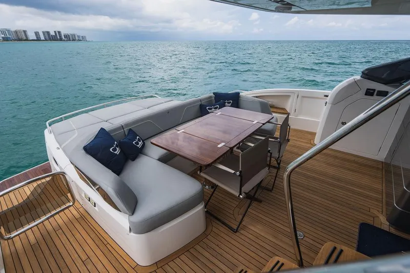 Slide: The Image of Luxury 2022 Princess S66 yacht deck with seating and ocean view. - 45
