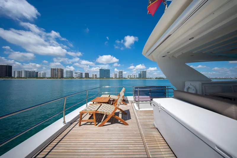 Slide: The Image of Luxurious 2015 Prestige 750 yacht deck with city skyline and ocean view. - 15