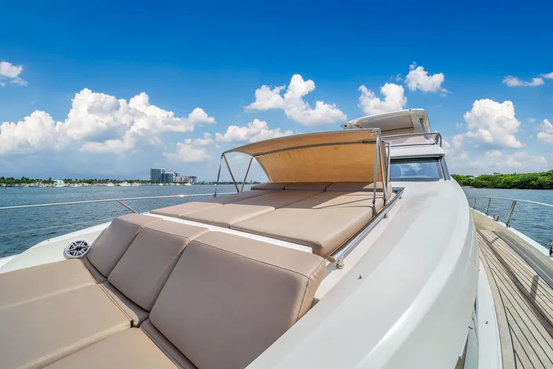 Slide: The Image of Luxury 2015 Prestige 750 yacht with sun deck, cruising on a sunny day. - 21