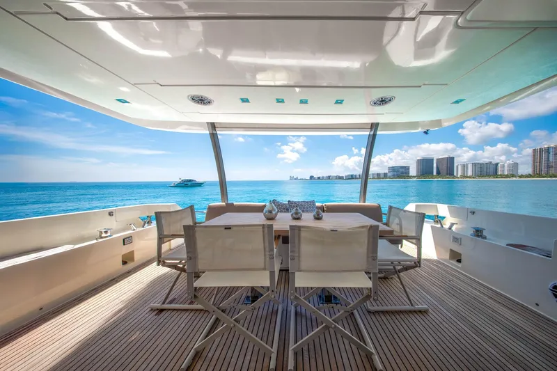 Slide: The Image of Luxury yacht deck view, Prestige 750, 2015 model, overlooking ocean and city skyline. - 22