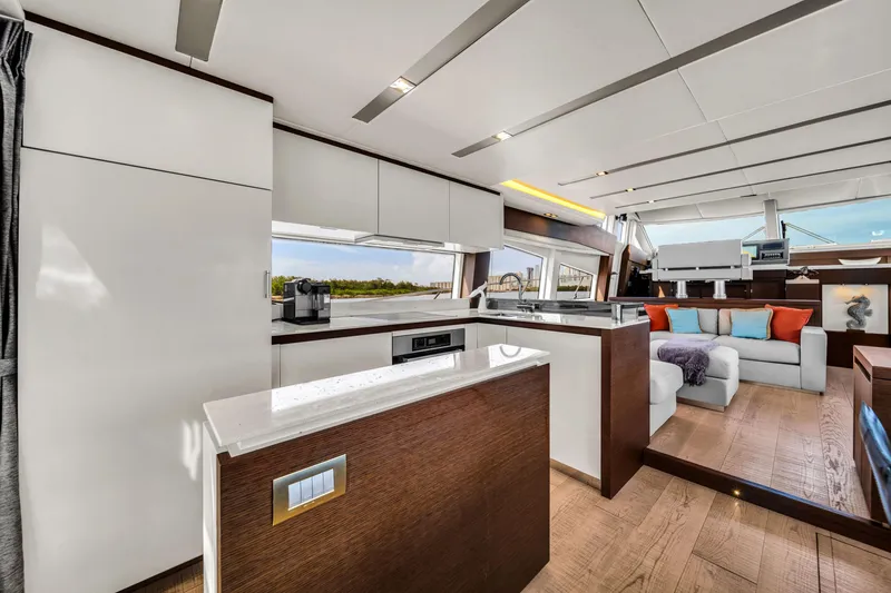 Slide: The Image of Luxurious interior of a 2015 Prestige 750 yacht with modern kitchen and seating area. - 29