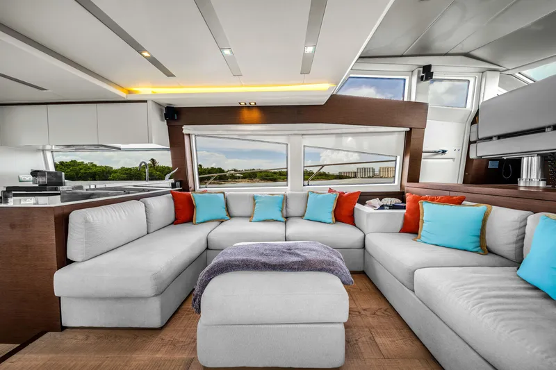 Slide: The Image of Luxurious interior of a 2015 Prestige 750 yacht with modern seating and colorful cushions. - 33