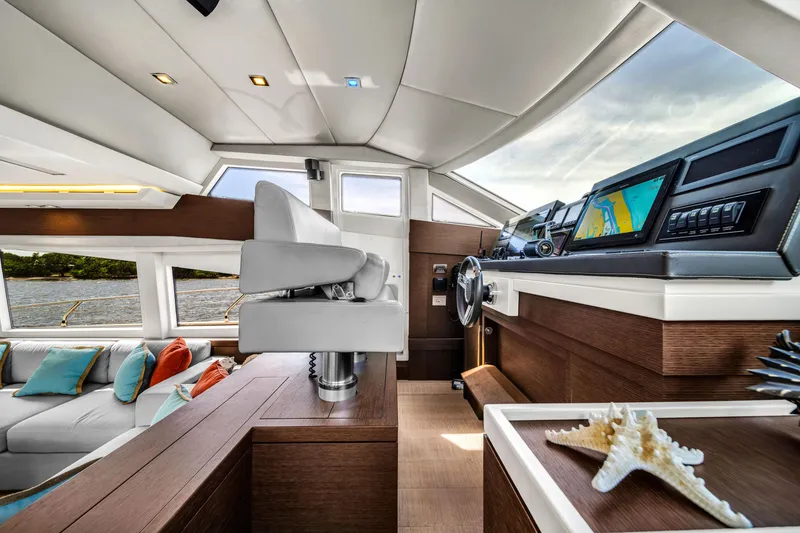 Slide: The Image of Luxurious interior of 2015 Prestige 750 yacht with modern helm and plush seating. - 34