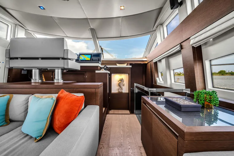 Slide: The Image of Luxurious interior of 2015 Prestige 750 yacht with modern decor and vibrant cushions. - 35