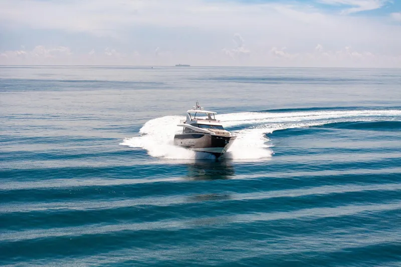 Slide: The Image of Luxurious 2015 Prestige 750 yacht cruising on open sea under clear skies. - 90