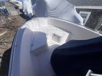 Slide: The Image of 2002 Grady-White Escape 209 boat, covered and docked outdoors. - 10