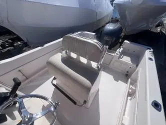 Slide: The Image of 2002 Grady-White Escape 209 boat interior with steering wheel and seating. - 5