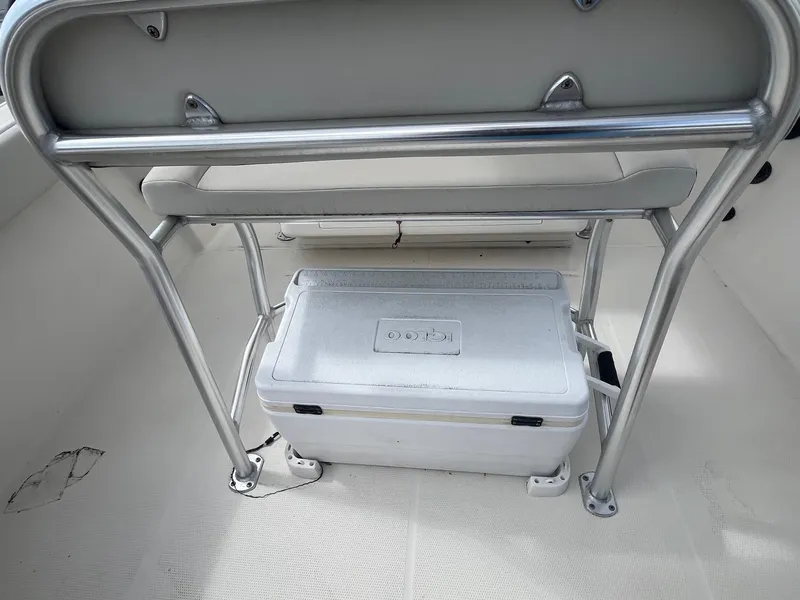 Slide: The Image of 2022 Sailfish 242 CC boat interior with cooler under seat. - 5