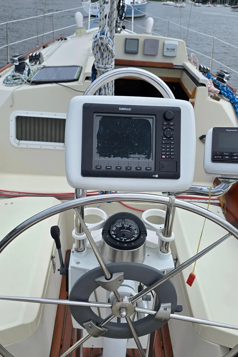 Slide: The Image of Cockpit of 1985 Mirage Yachts 35 with navigation equipment and steering wheel. - 10