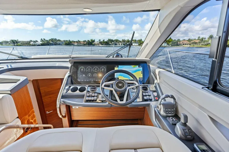 Slide: The Image of Modern helm of 2025 Princess F50 yacht with advanced navigation system and luxurious interior. - 1