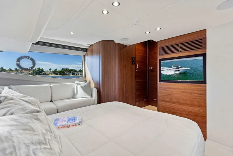 Slide: The Image of Luxurious interior of 2025 Princess F50 yacht with elegant seating and scenic views. - 12