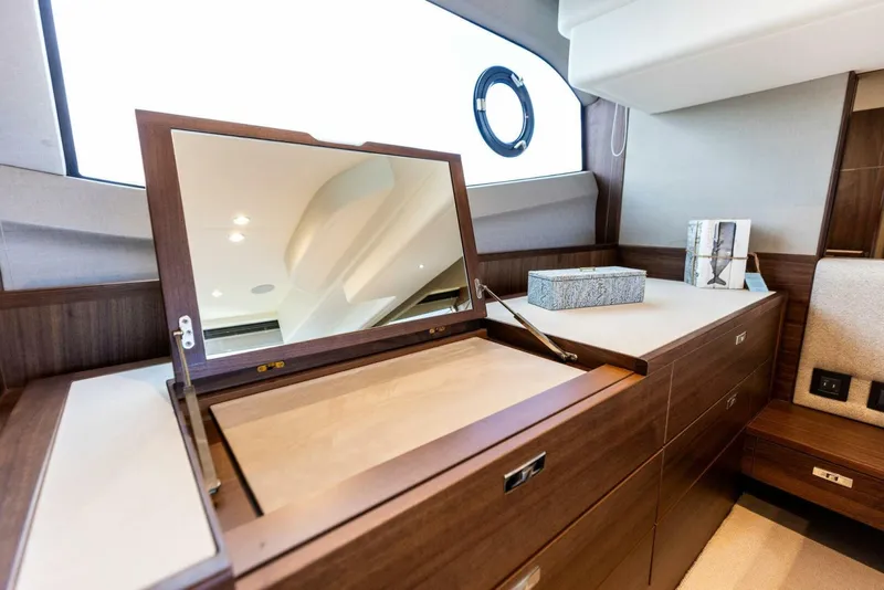 Slide: The Image of Luxurious interior of 2025 Princess F50 yacht with elegant seating and scenic water view. - 13
