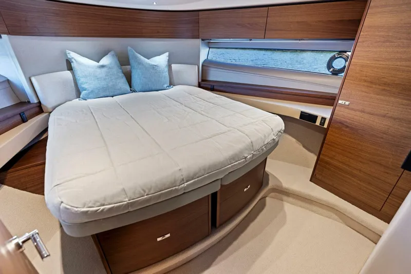 Slide: The Image of Luxurious 2025 Princess F50 yacht interior with elegant bedroom and scenic water view. - 18
