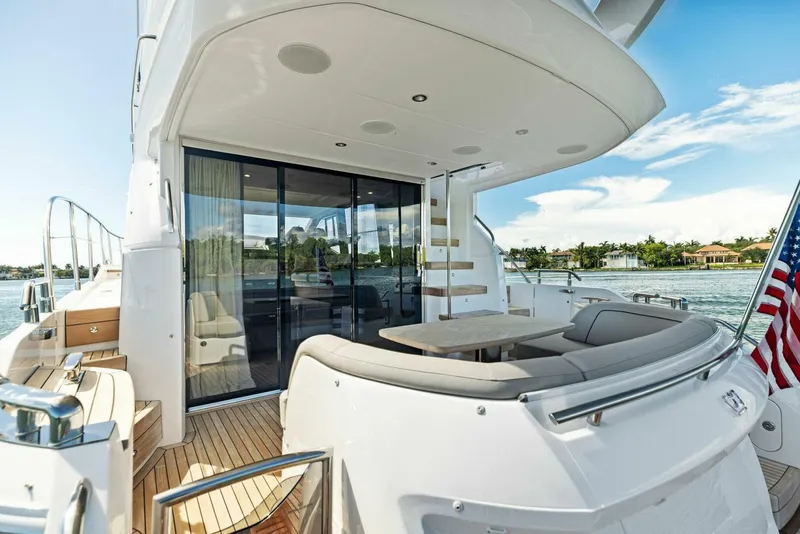 Slide: The Image of Luxurious yacht bathroom with wooden cabinetry, modern sink, and toilet. Princess F50, 2025 model. - 23