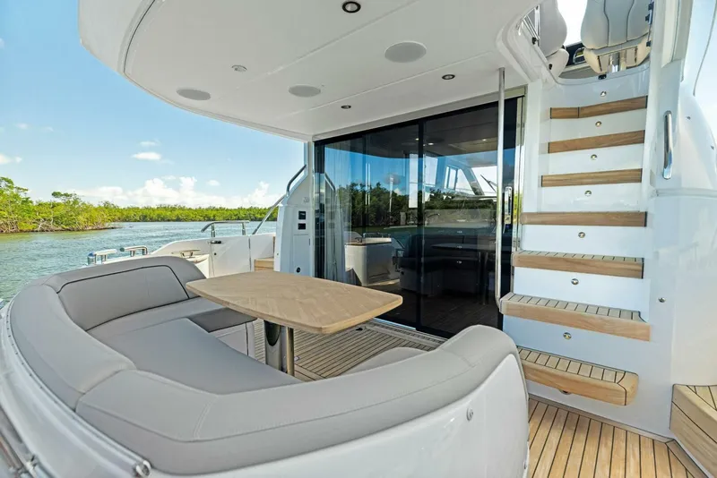 Slide: The Image of Luxurious cabin interior of 2025 Princess F50 yacht with elegant bedding and wood accents. - 26