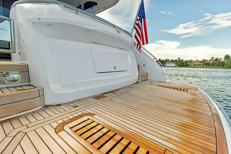 Slide: The Image of Luxurious 2025 Princess F50 yacht deck with seating, table, and scenic waterfront view. - 31