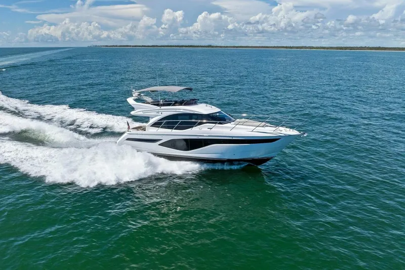 Slide: The Image of Luxurious 2025 Princess F50 yacht cruising on open sea under clear skies. - 45