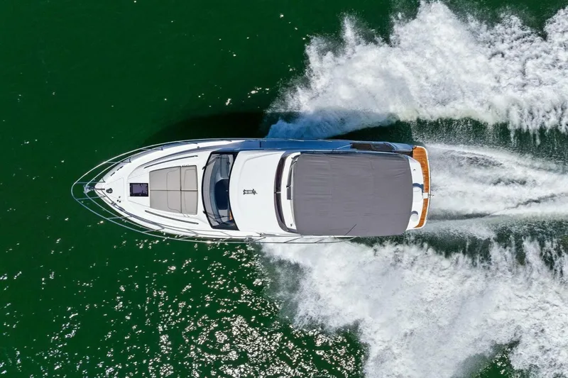 Slide: The Image of Aerial view of 2025 Princess F50 yacht cruising on green water. - 48