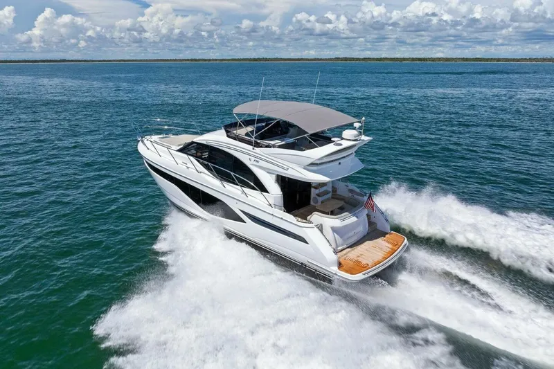 Slide: The Image of Luxurious 2025 Princess F50 yacht cruising on open water under a clear sky. - 49